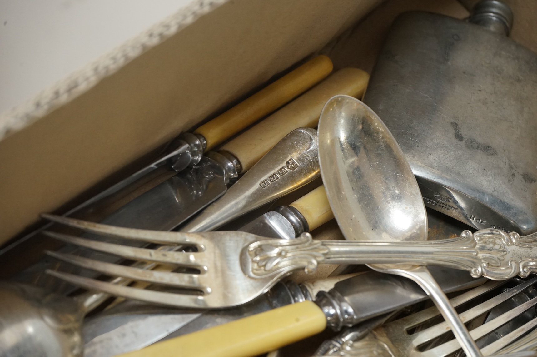 A pair of Victorian silver King's pattern table spoons by George Adams, London, 1858, a silver teaspoon, a mounted glass scent bottle, a silver cigarette case, a continental canister with inset coin lid, and assorted pla